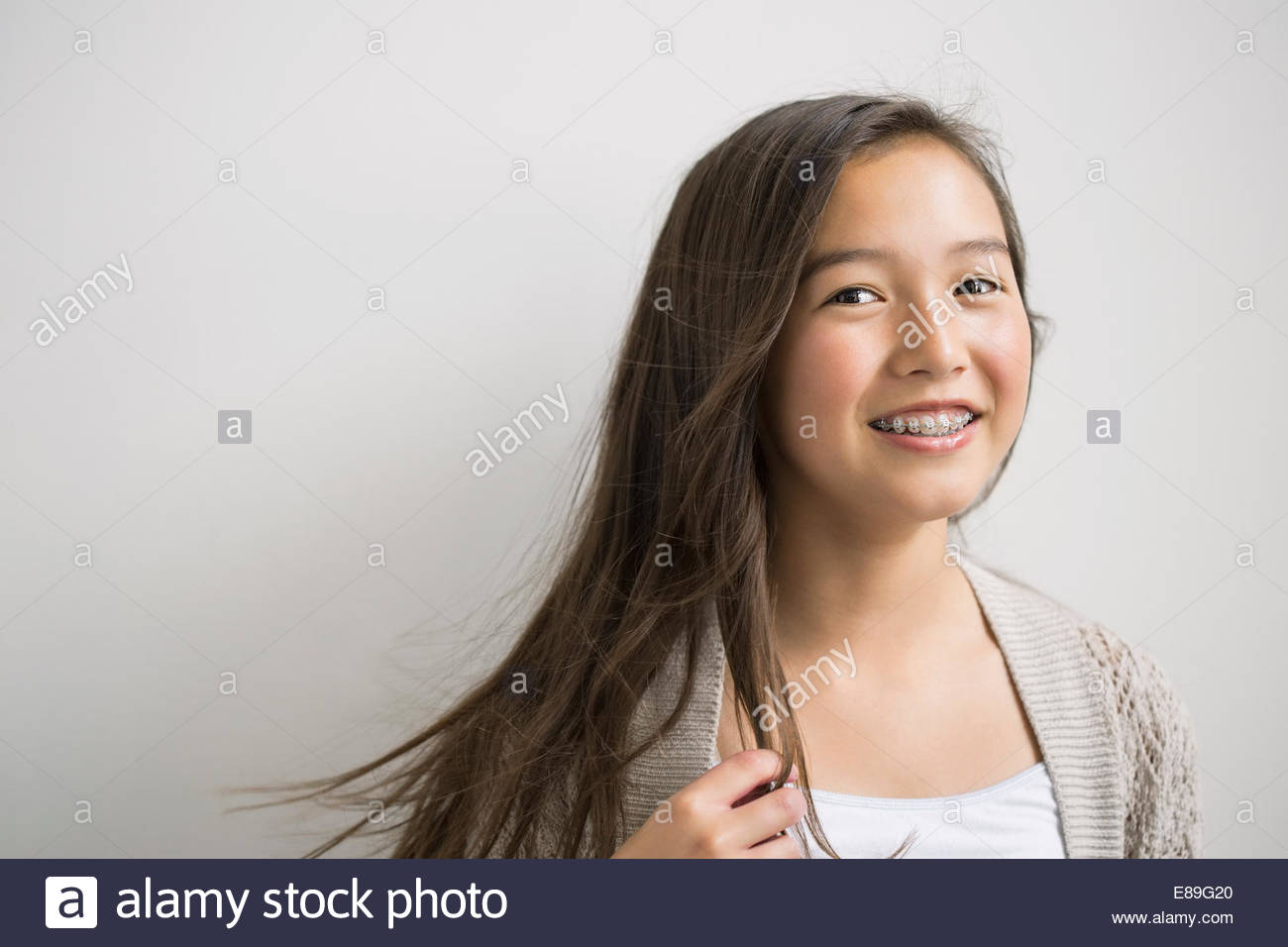Portrait of smiling brunette girl with braces Stock Photo