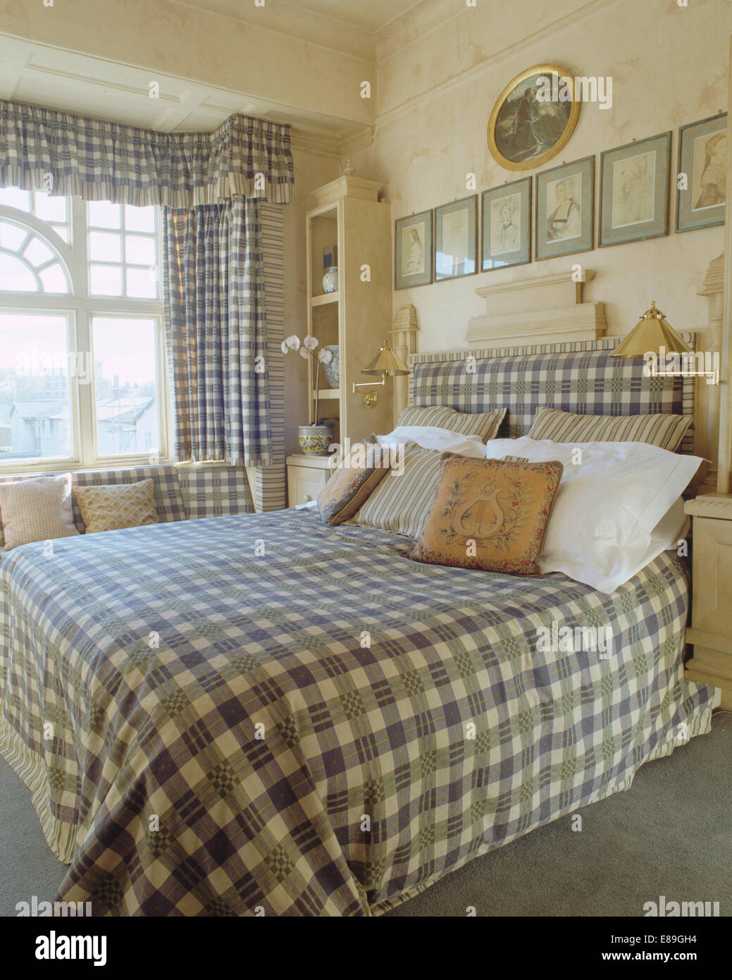 Grey and white checked bedcover and curtains with matching headboard in