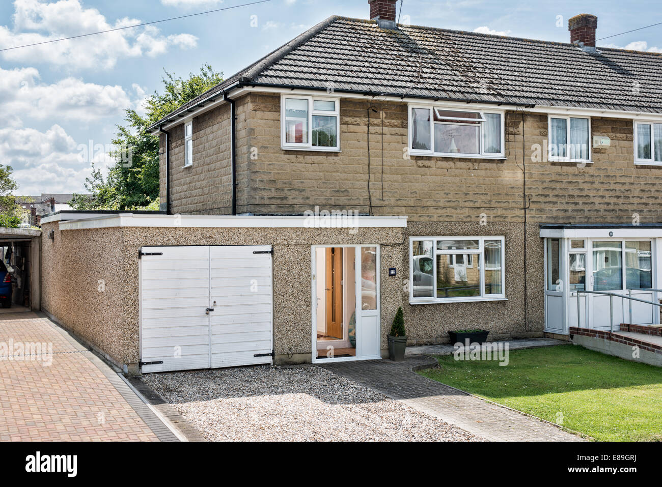 A typical 1950's suburban block built home on a development in Swindon, Wiltshire, UK on a sunny sumer day Stock Photo