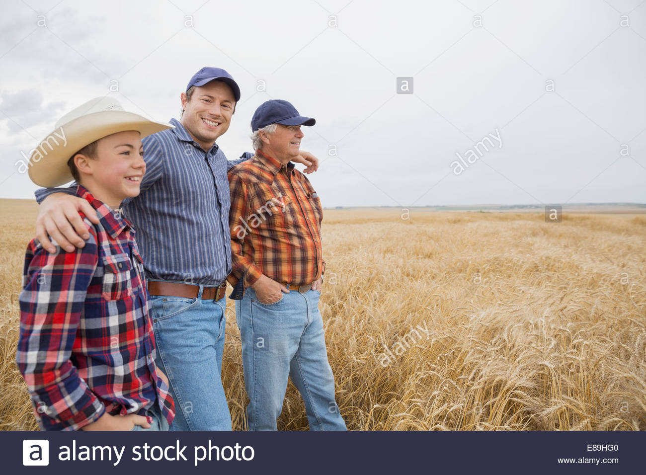 Multi-generation men in wheat field Stock Photo