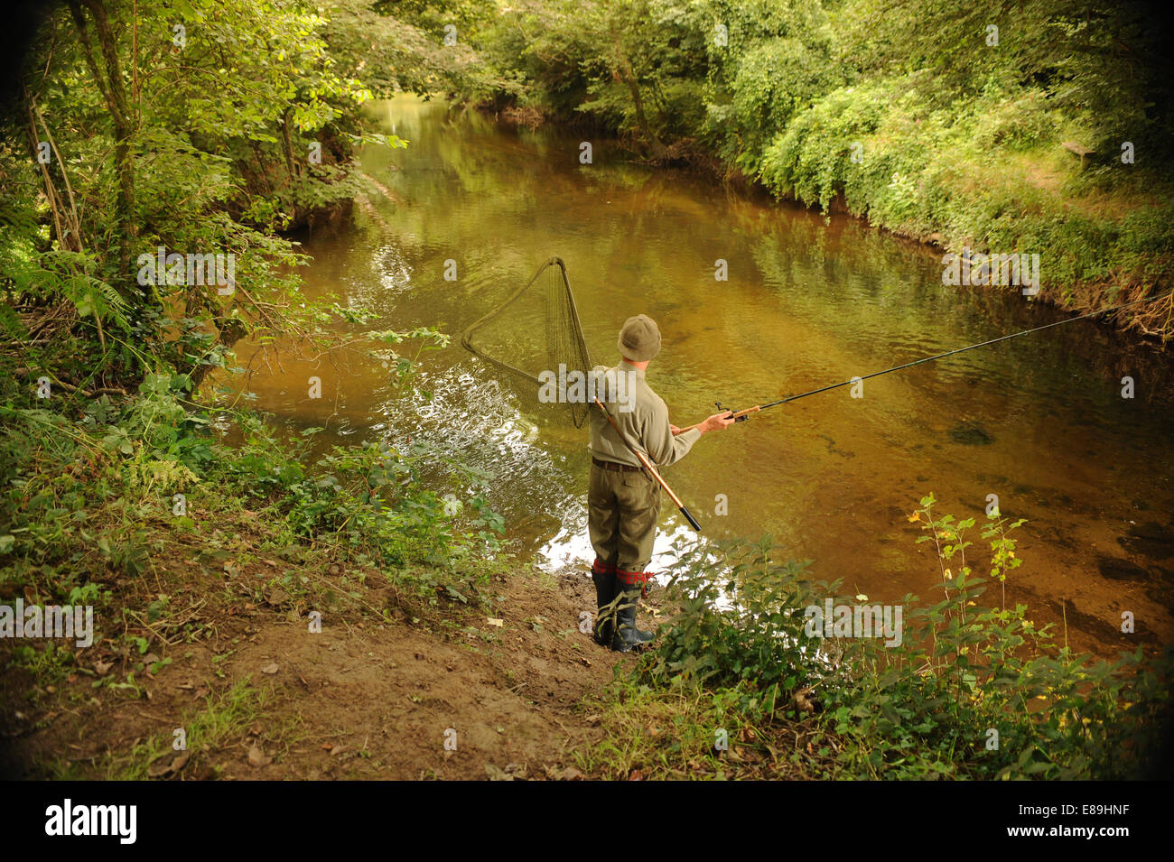Fishing for trout salmon river camel Cornwall river bank Stock Photo - Alamy
