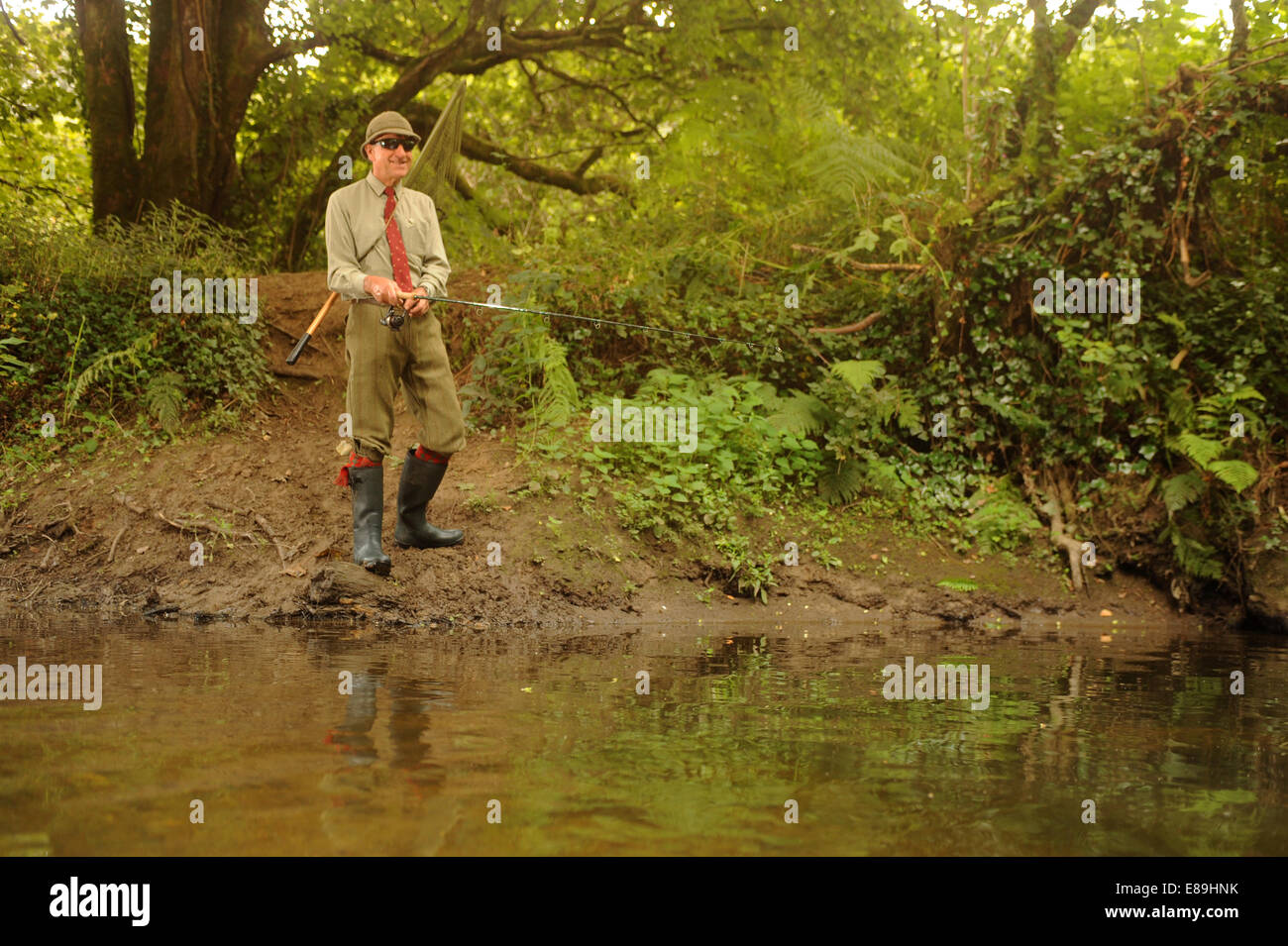 Fishing for trout salmon river camel Cornwall river bank Stock Photo