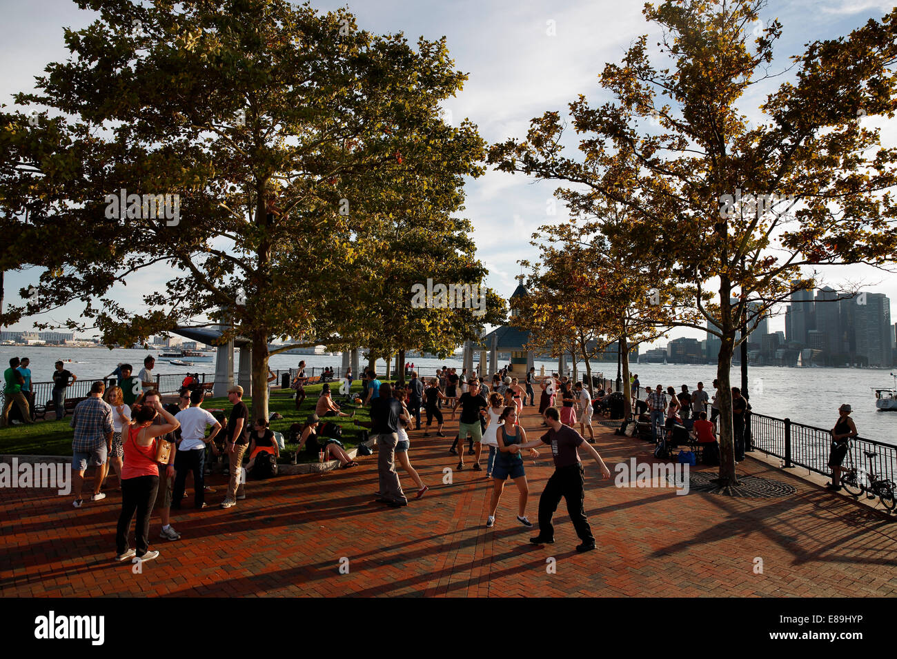 A group of people swing dancing in Piers Park, Boston, Massachusetts, USA Stock Photo