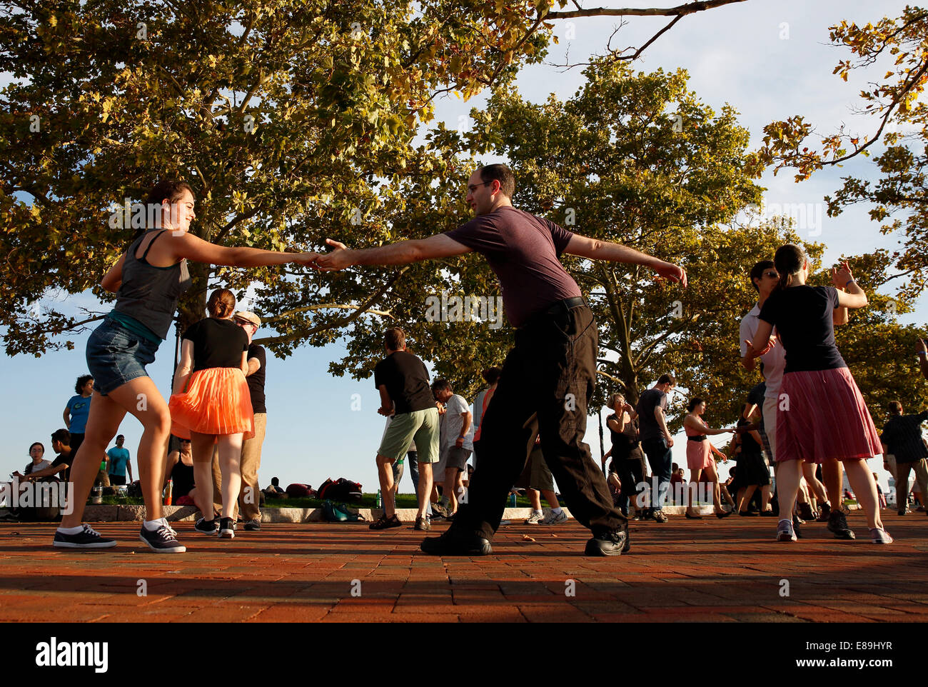 A group of people swing dancing in Piers Park, Boston, Massachusetts, USA Stock Photo