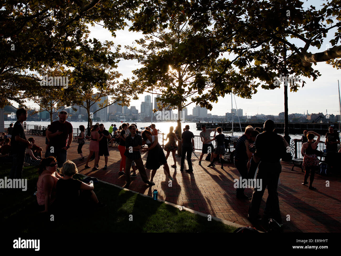 A group of people swing dancing in Piers Park, Boston, Massachusetts, USA Stock Photo