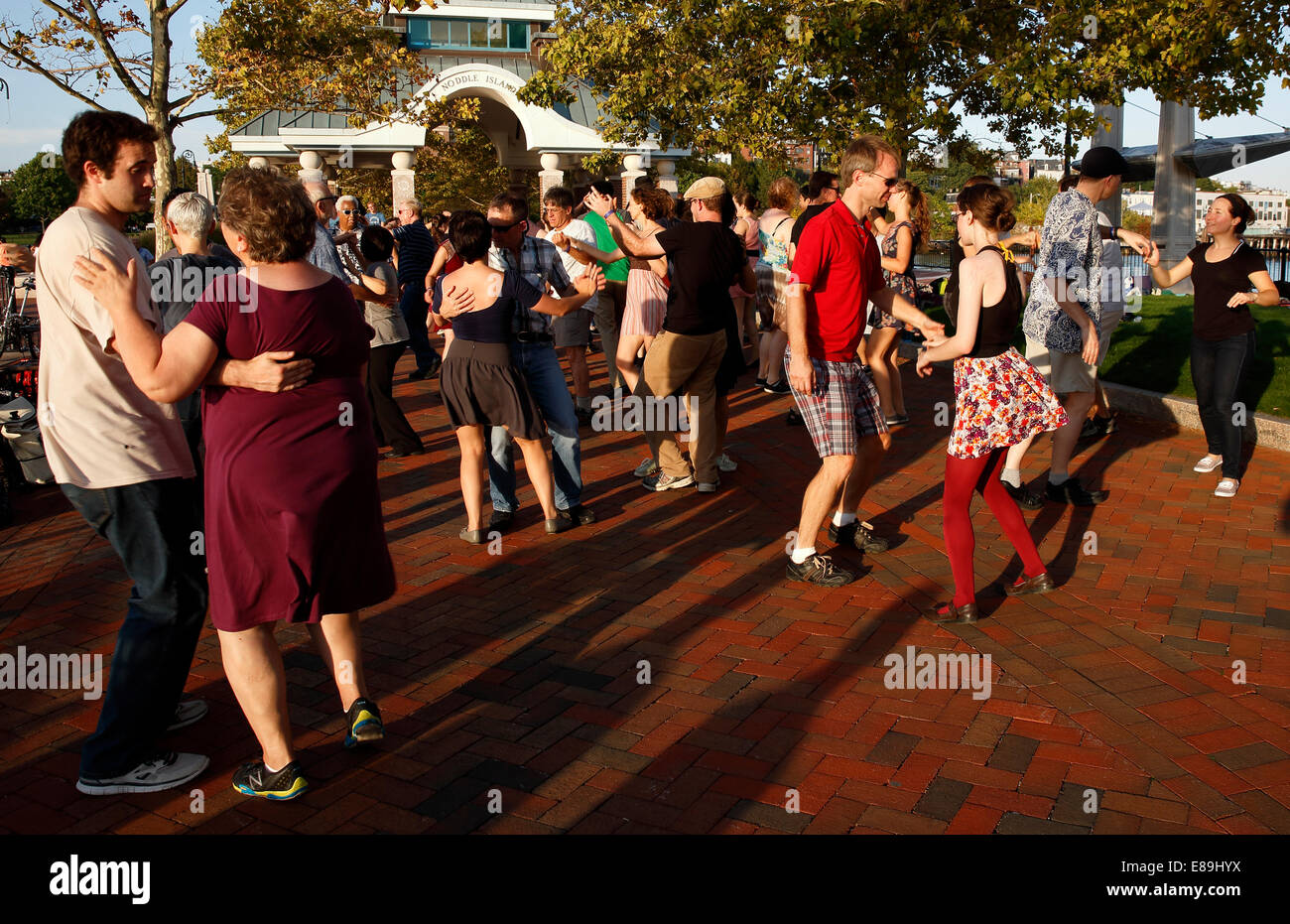 A group of people swing dancing in Piers Park, Boston, Massachusetts, USA Stock Photo