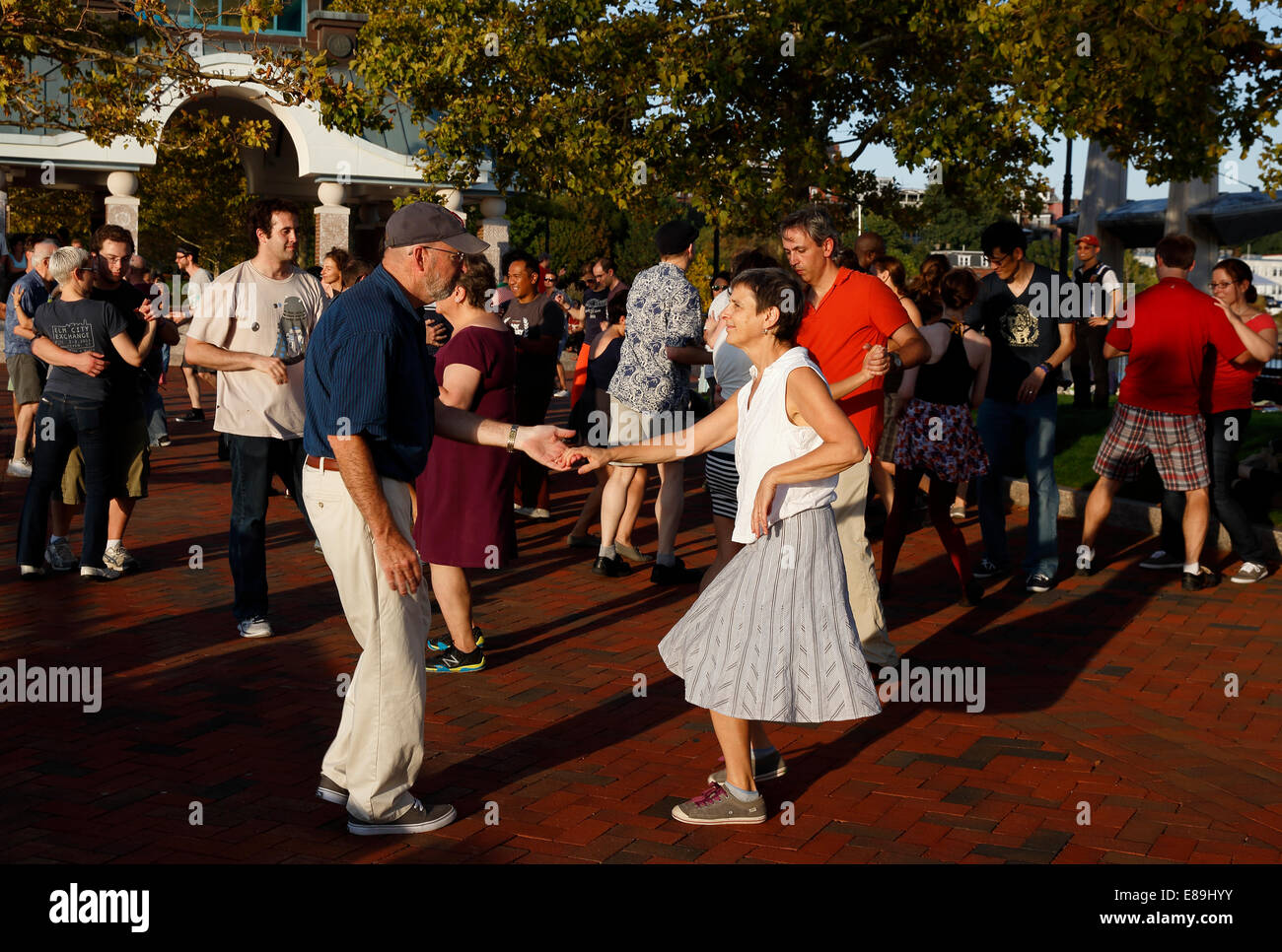 A group of people swing dancing in Piers Park, Boston, Massachusetts, USA Stock Photo