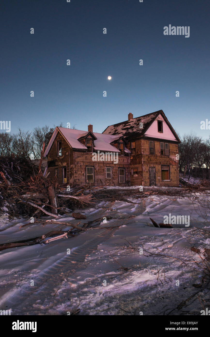 Old farmhouse being demolished to ready land for redevelopment Stock Photo