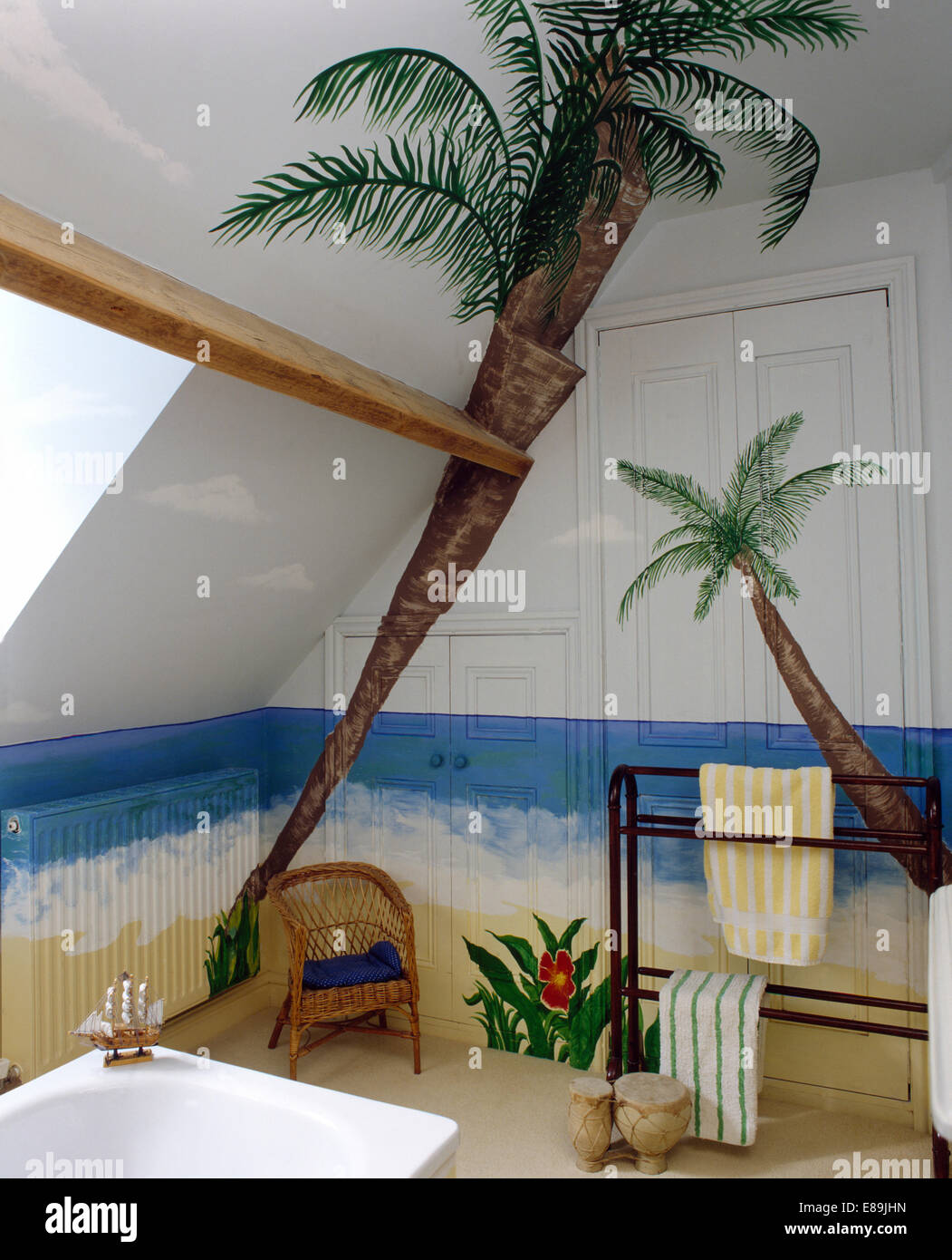 Palm tree mural in attic bathroom with mahogany towel rail Stock Photo Alamy