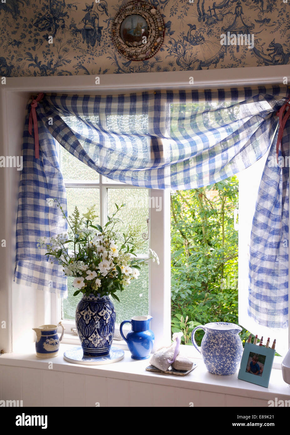 Close Up Of Blue Checked Draped Fabric On Open Bathroom Window