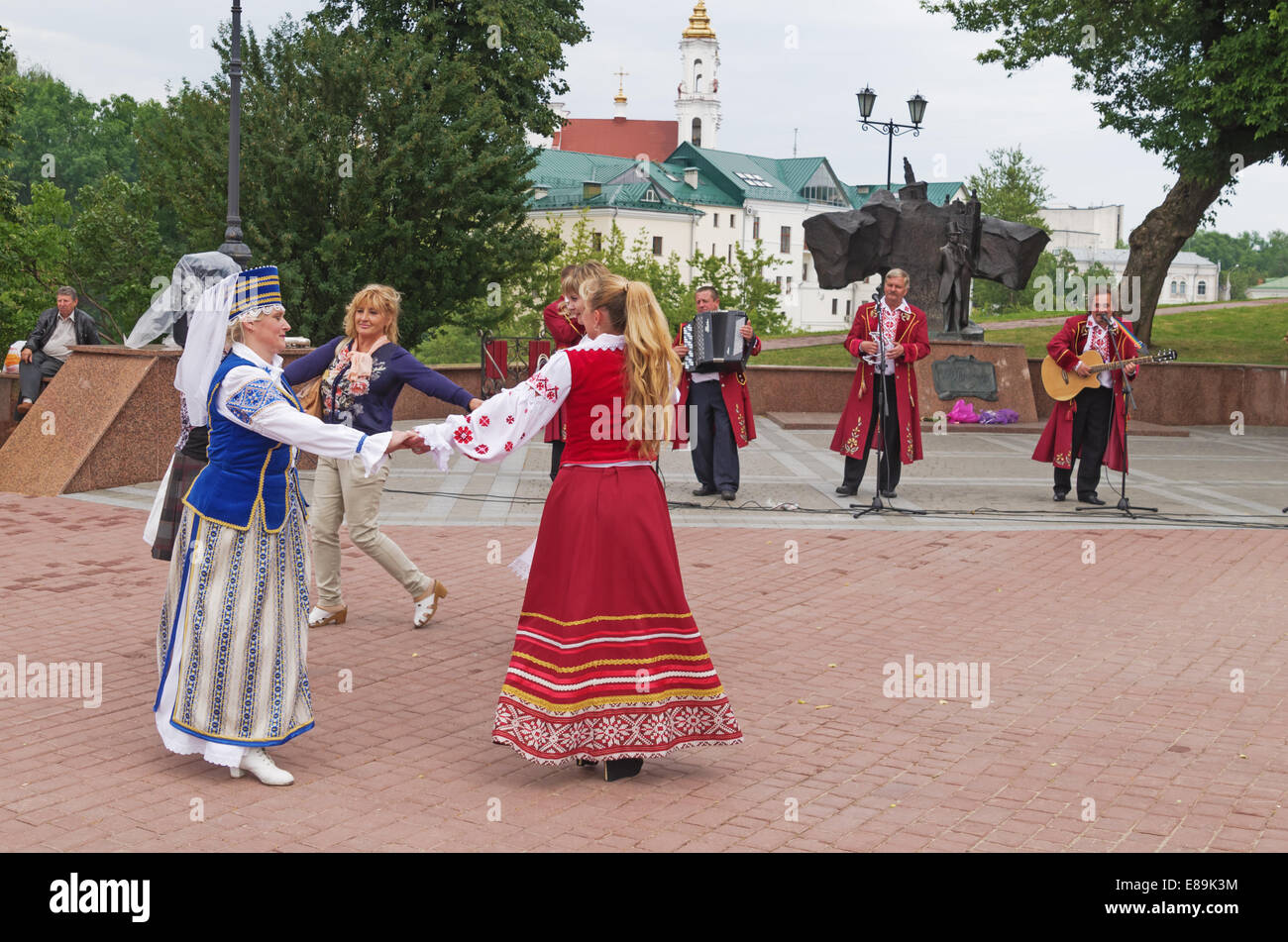 The Belarus folklore groups sings on streets in Vitebsk. Viewers dances