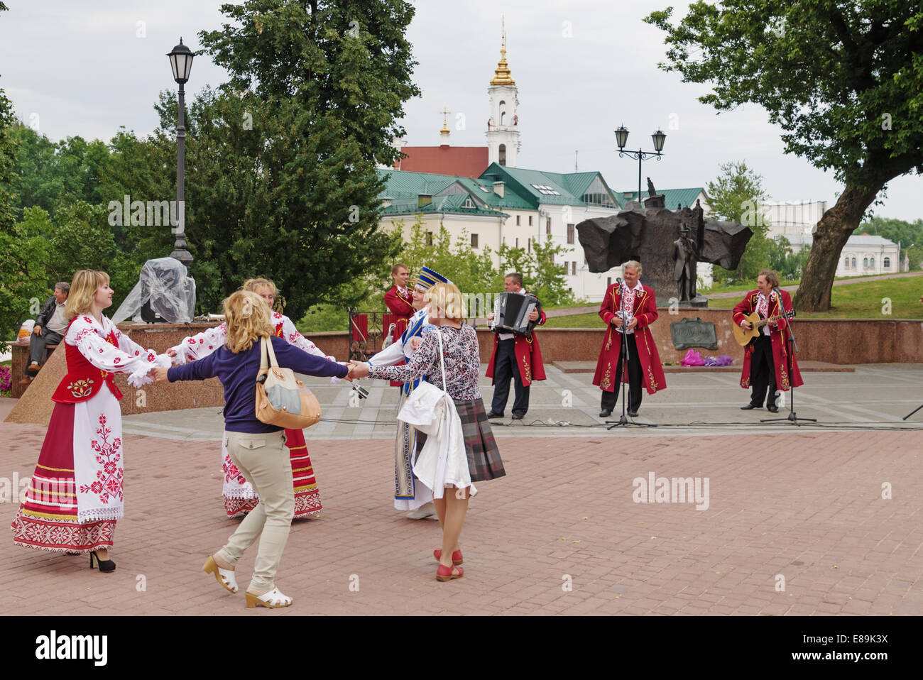 The Belarus folklore groups sings on streets in Vitebsk. Viewers dances