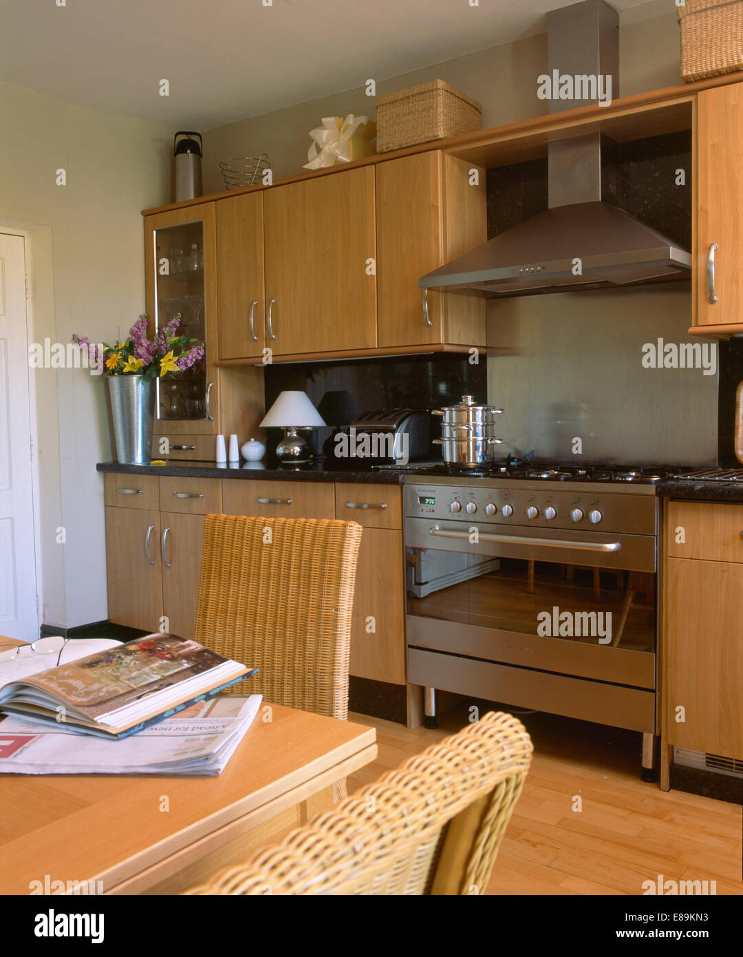 Modern kitchen cream units stainless steel fridge interiors kitchens  appliances Stock Photo - Alamy