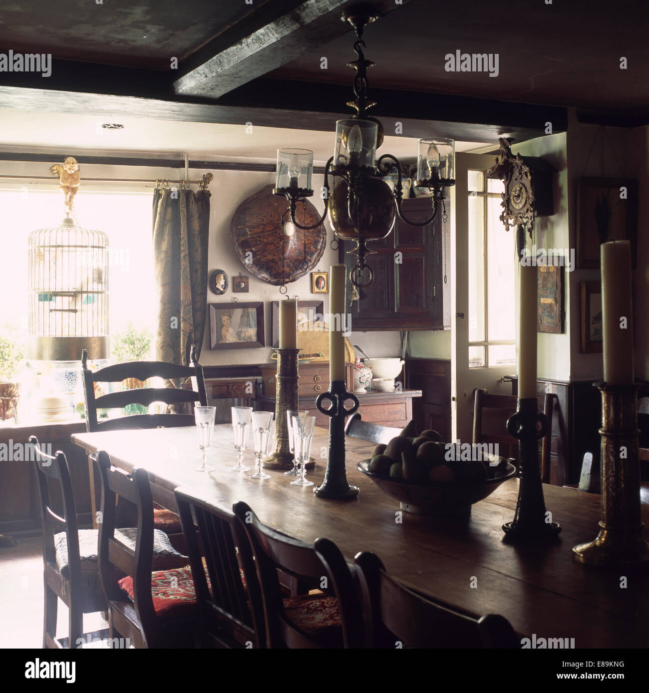 Antique oak table and chair in country dining room Stock Photo - Alamy