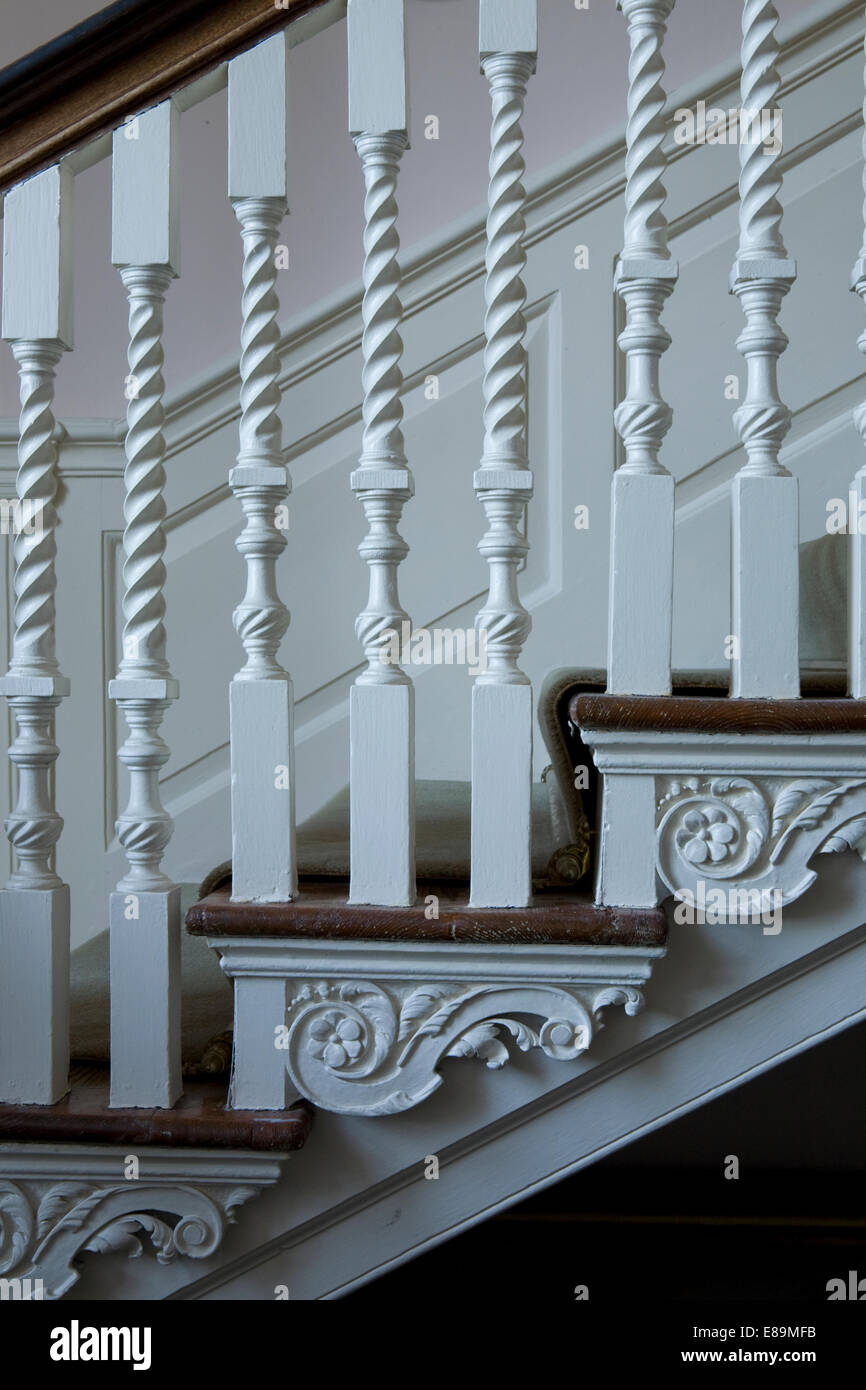 Closeup of white painted banisters on staircase Stock Photo Alamy