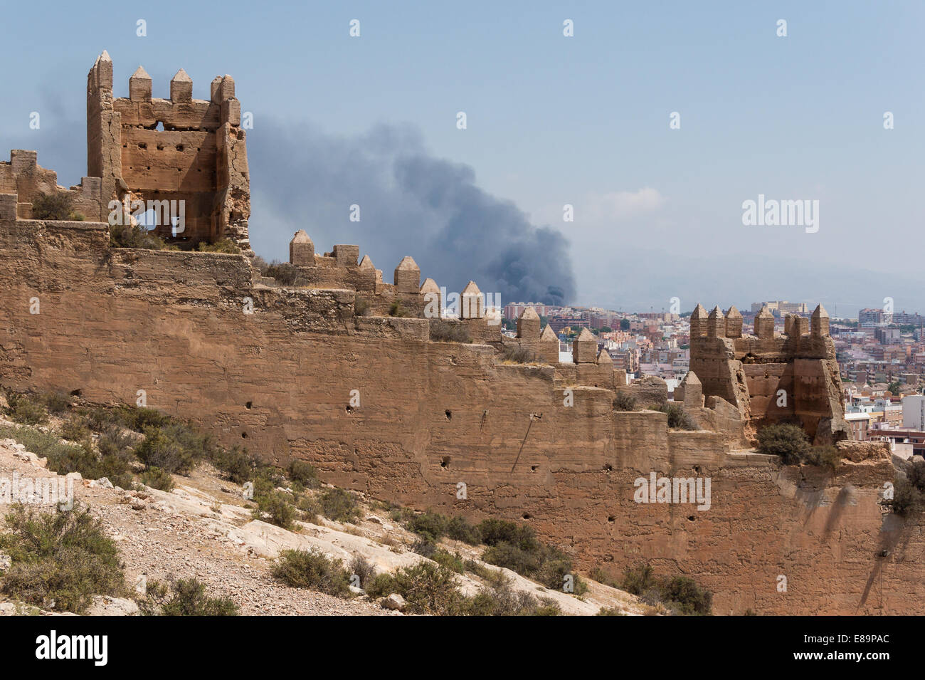 the-image-depicts-fortifications-in-almeria-spain-with-a-fire-burning