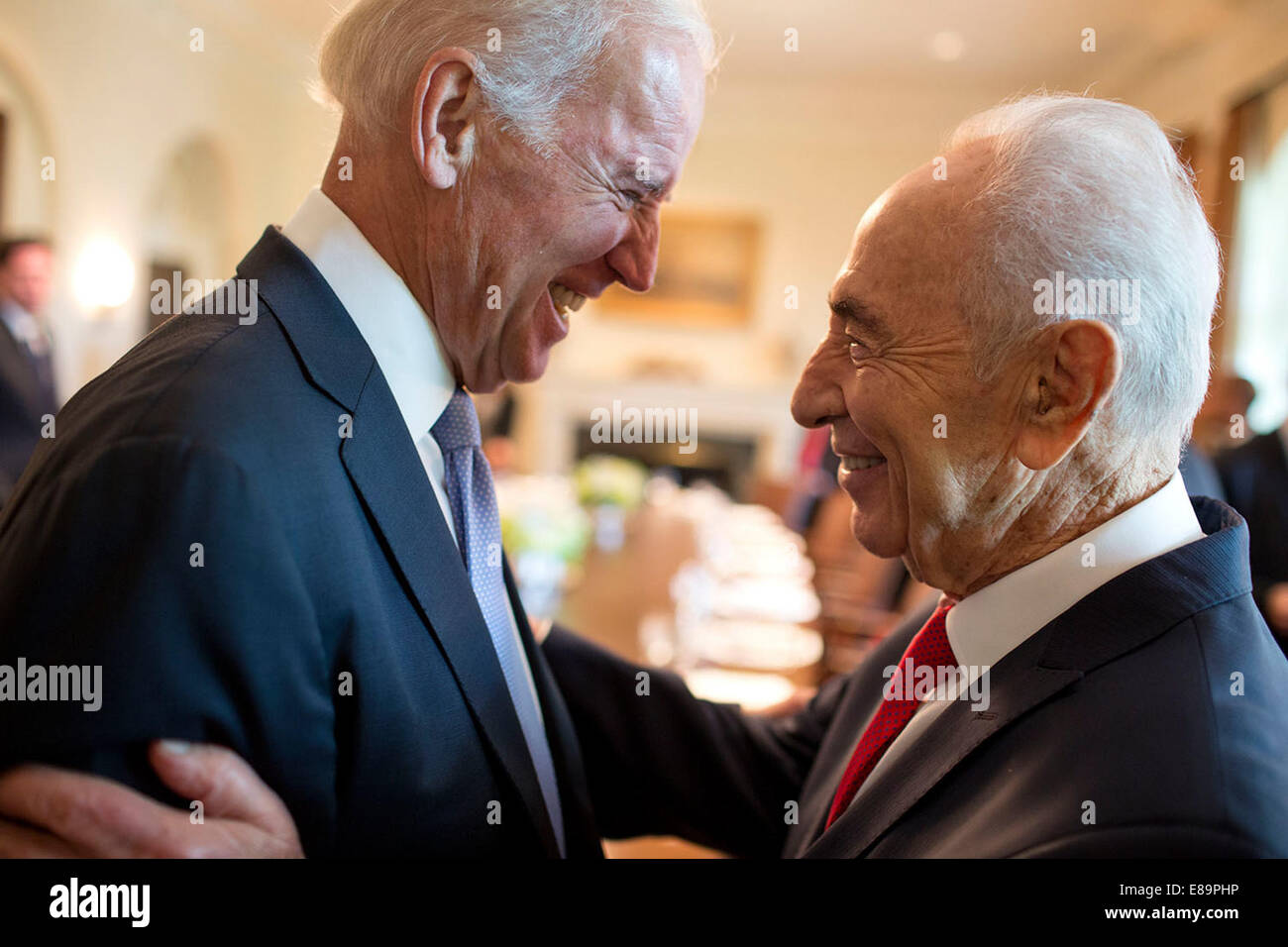 Vice President Joe Biden greets President Shimon Peres of Israel prior to lunch in the Cabinet Room of the White House, June 25, 2014. Stock Photo