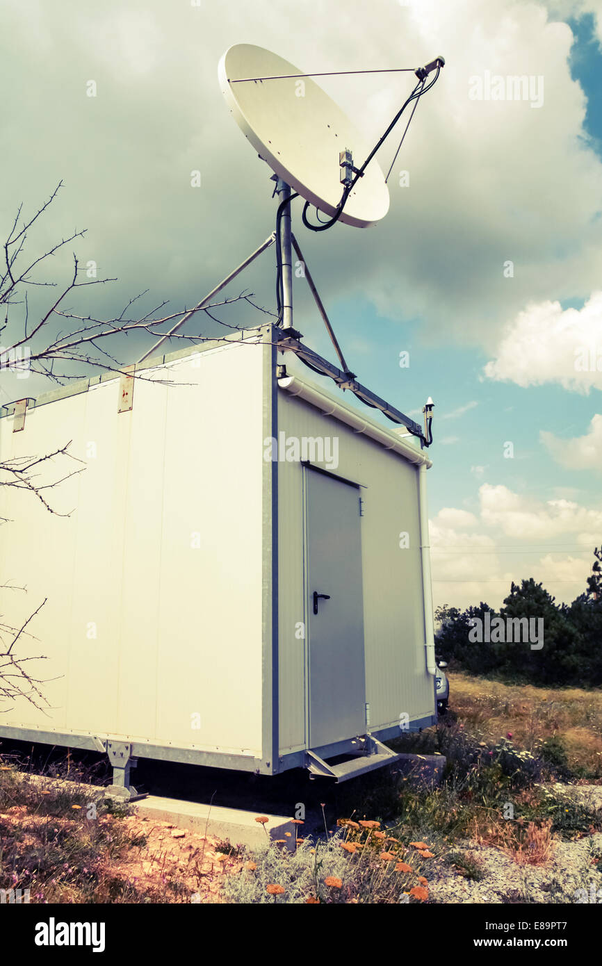 Satellite antenna of small observation station. Vintage retro toned
