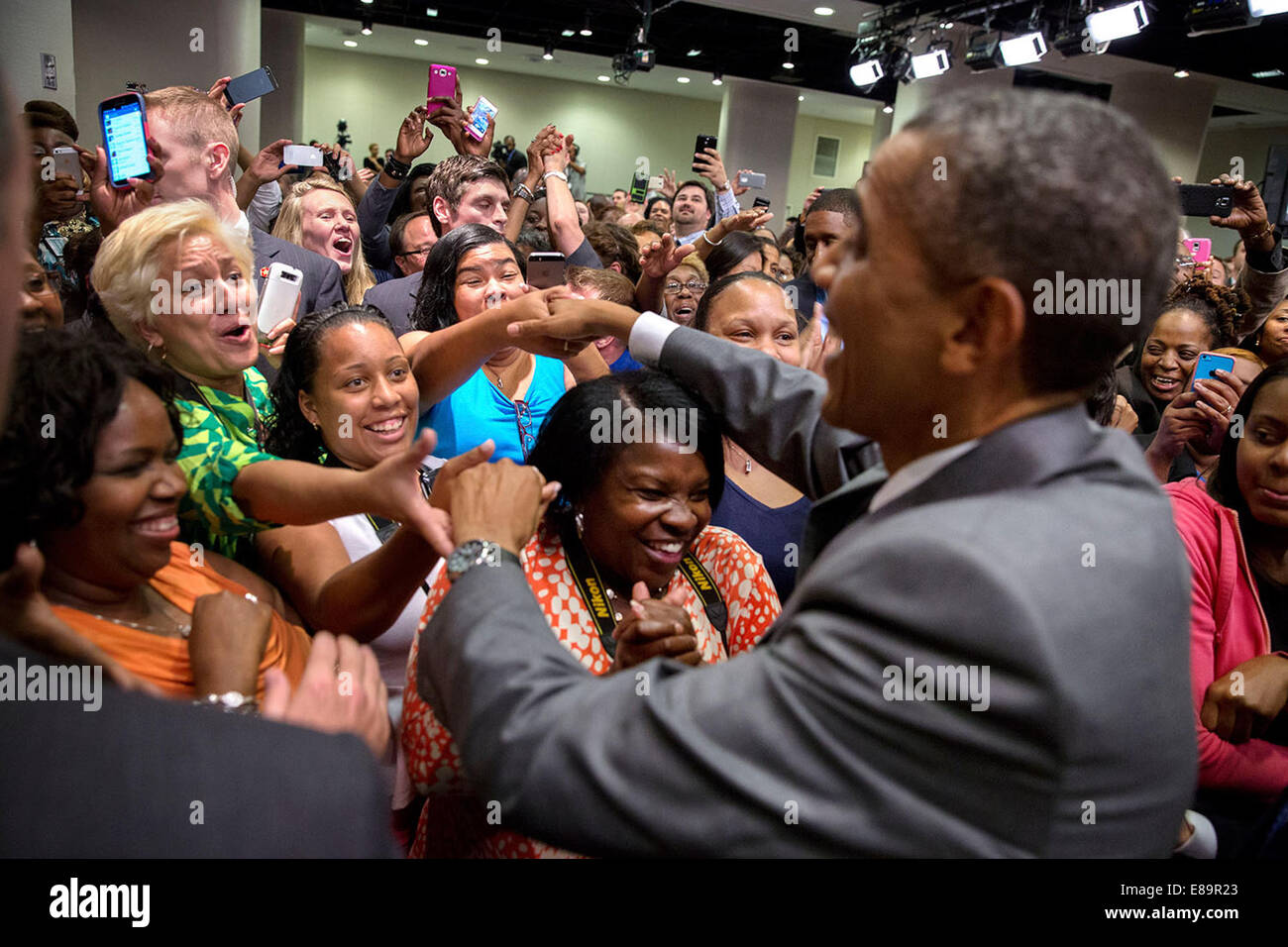 President Barack Obama greets HUD staff following remarks at the Department of Housing and Urban Development in Washington, D.C., July 31, 2014. Stock Photo