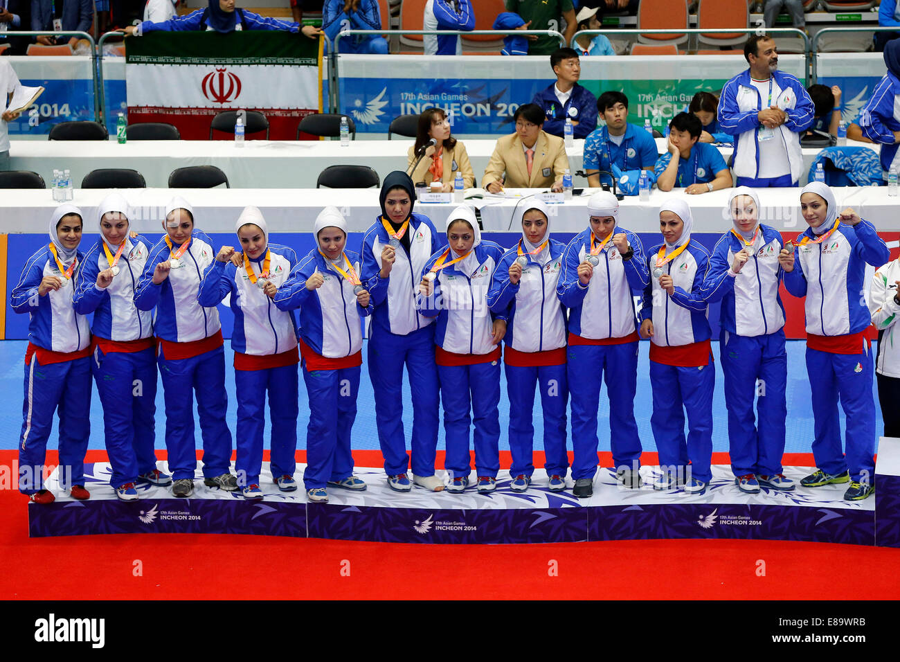 (141003) -- INCHEON, Oct. 3, 2014 (Xinhua) -- Silver medalists athletes of Iran pose on the podium during the awarding ceremony of the women's team match of kabaddi at the 17th Asian Games in Incheon, South Korea, Oct. 3, 2014. (Xinhua/Shen Bohan)(lz) Stock Photo