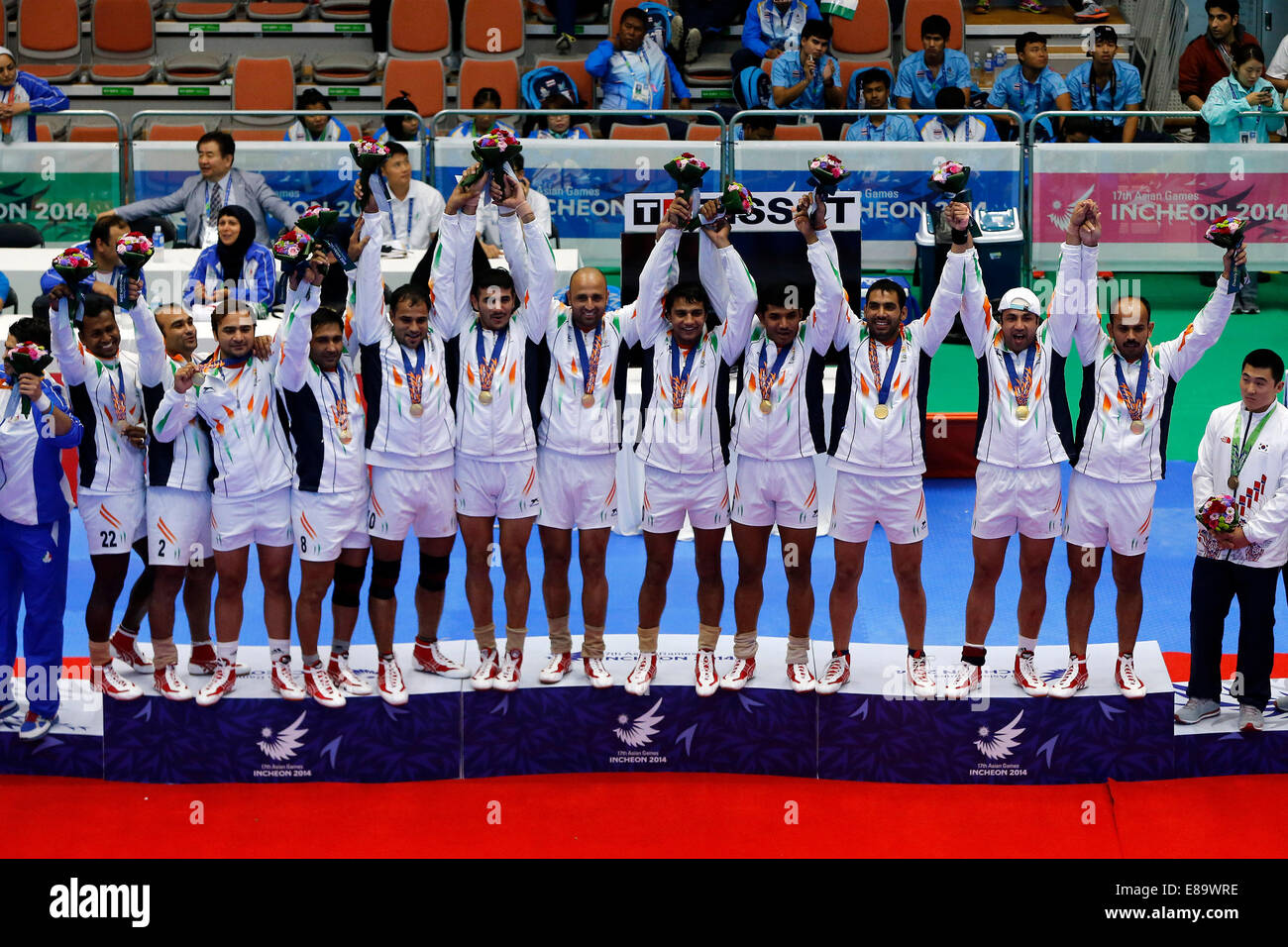 (141003) -- INCHEON, Oct. 3, 2014 (Xinhua) -- Gold medalists athletes of India pose on the podium during the awarding ceremony of the men's team match of kabaddi at the 17th Asian Games in Incheon, South Korea, Oct. 3, 2014. (Xinhua/Shen Bohan)(lz) Stock Photo