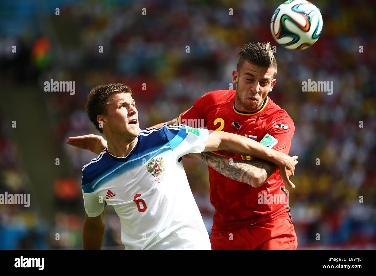 Maksim Kanunnikov of Russia and Toby Alderweireld of Belgium. Russia v Belgium, group match. FIFA World Cup Brazil 2014, Maracan Stock Photo