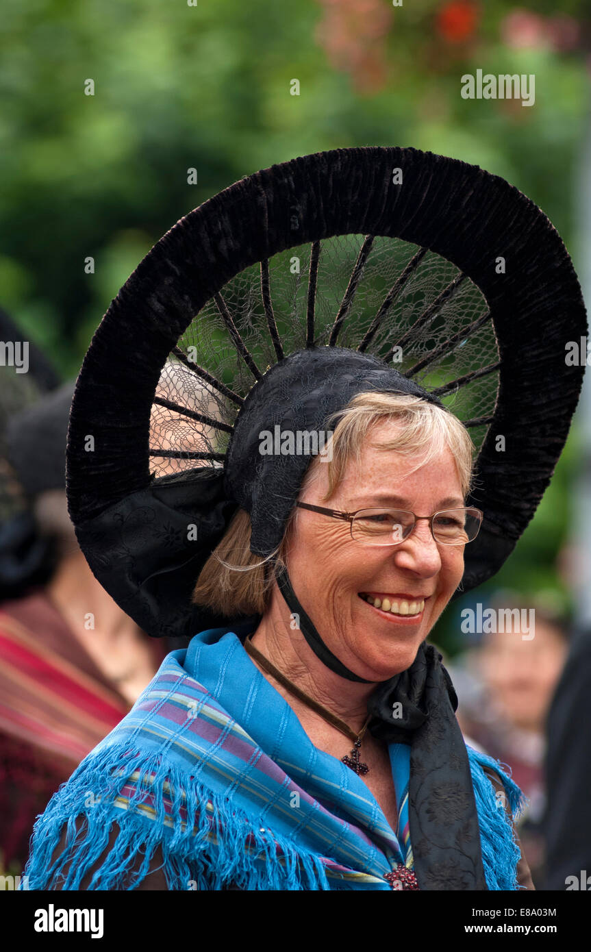 Traditional Swiss costume, woman wearing a Radhaube headdress from the