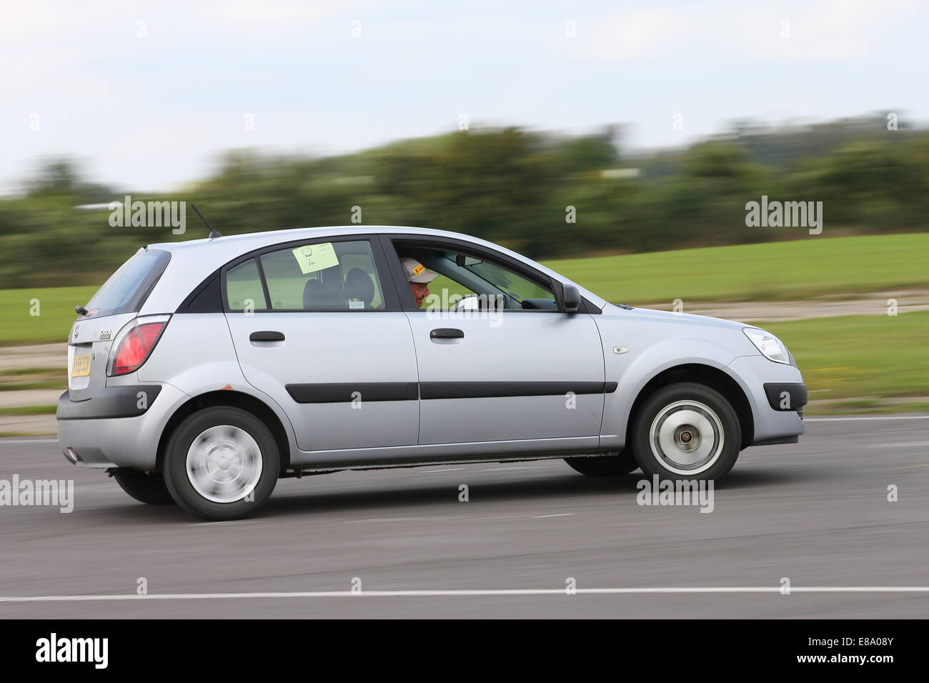 A car takes part in an Autosolo at an airfield Stock Photo - Alamy