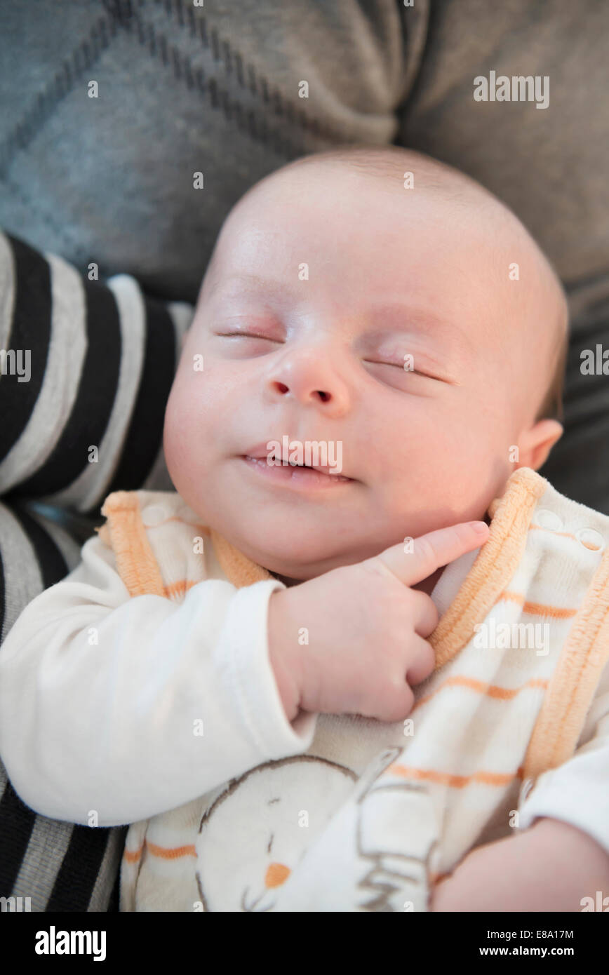Baby sleeping in father arms hires stock photography and images Alamy