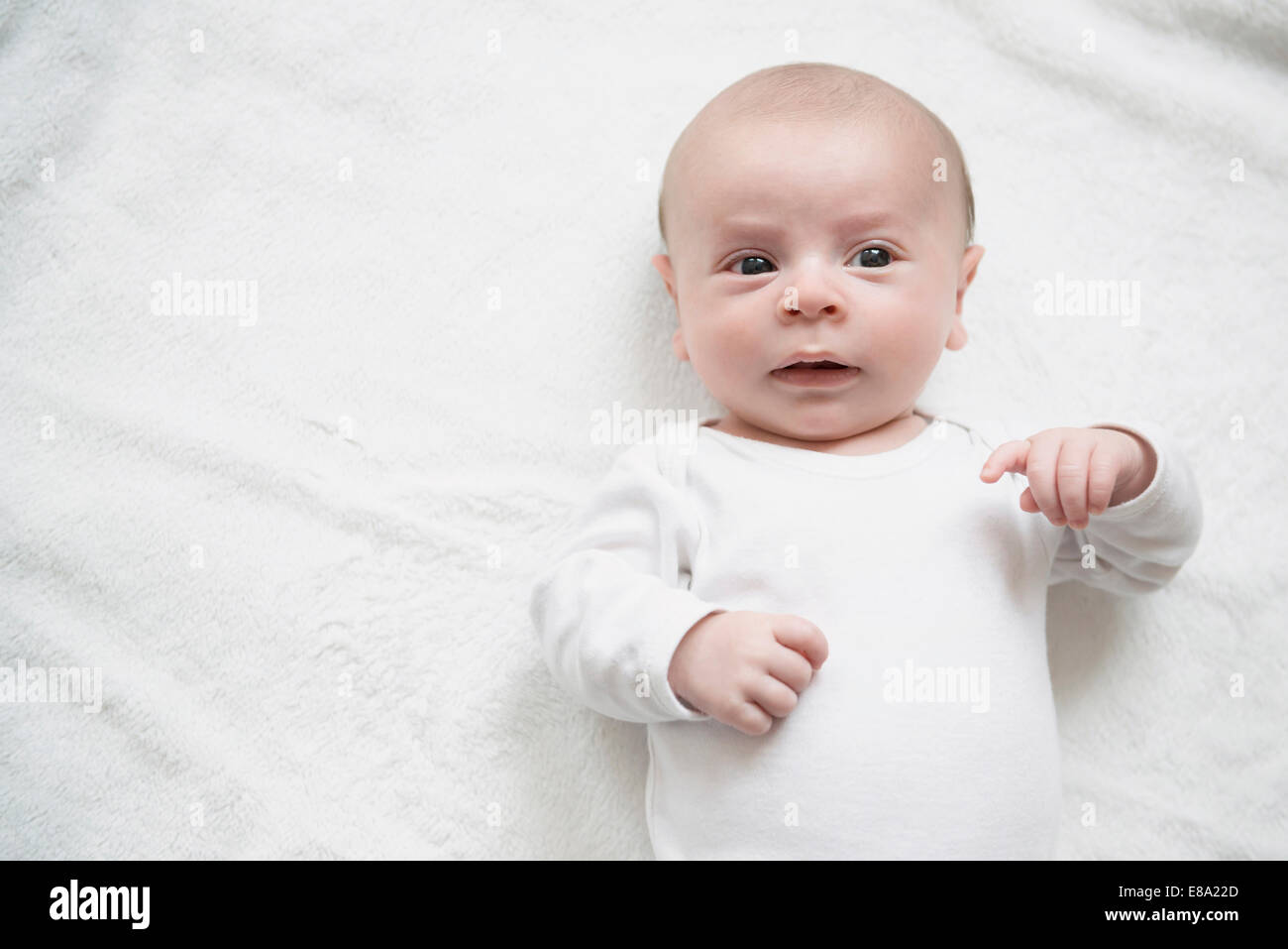 Baby boy playing on bed Stock Photo