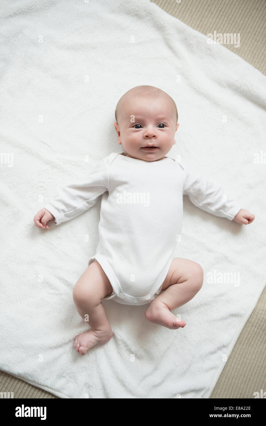 Baby boy playing on bed Stock Photo