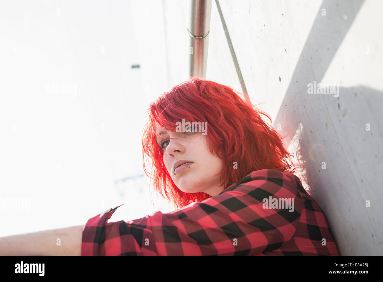Portrait young defiant teenage dyed hair piercings Stock Photo