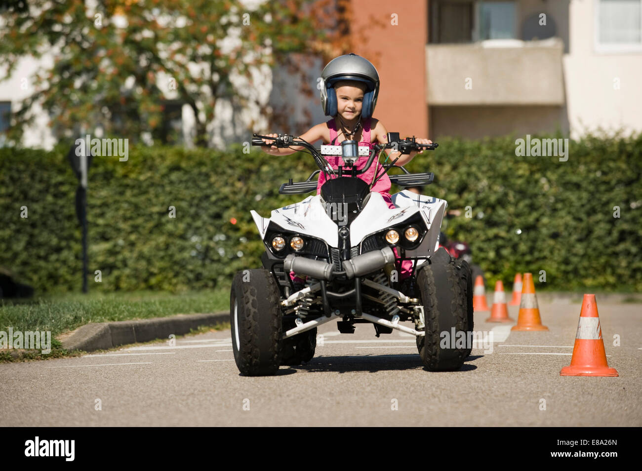 Girl with quadbike on driver training area Stock Photo