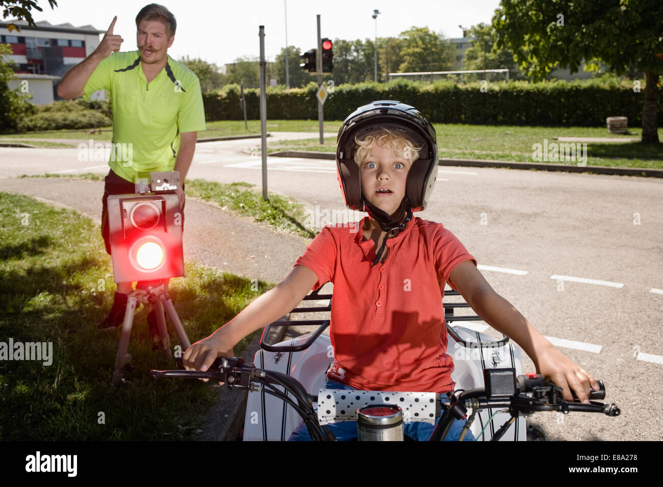 Boy and tutor on driver training area at speed trap Stock Photo