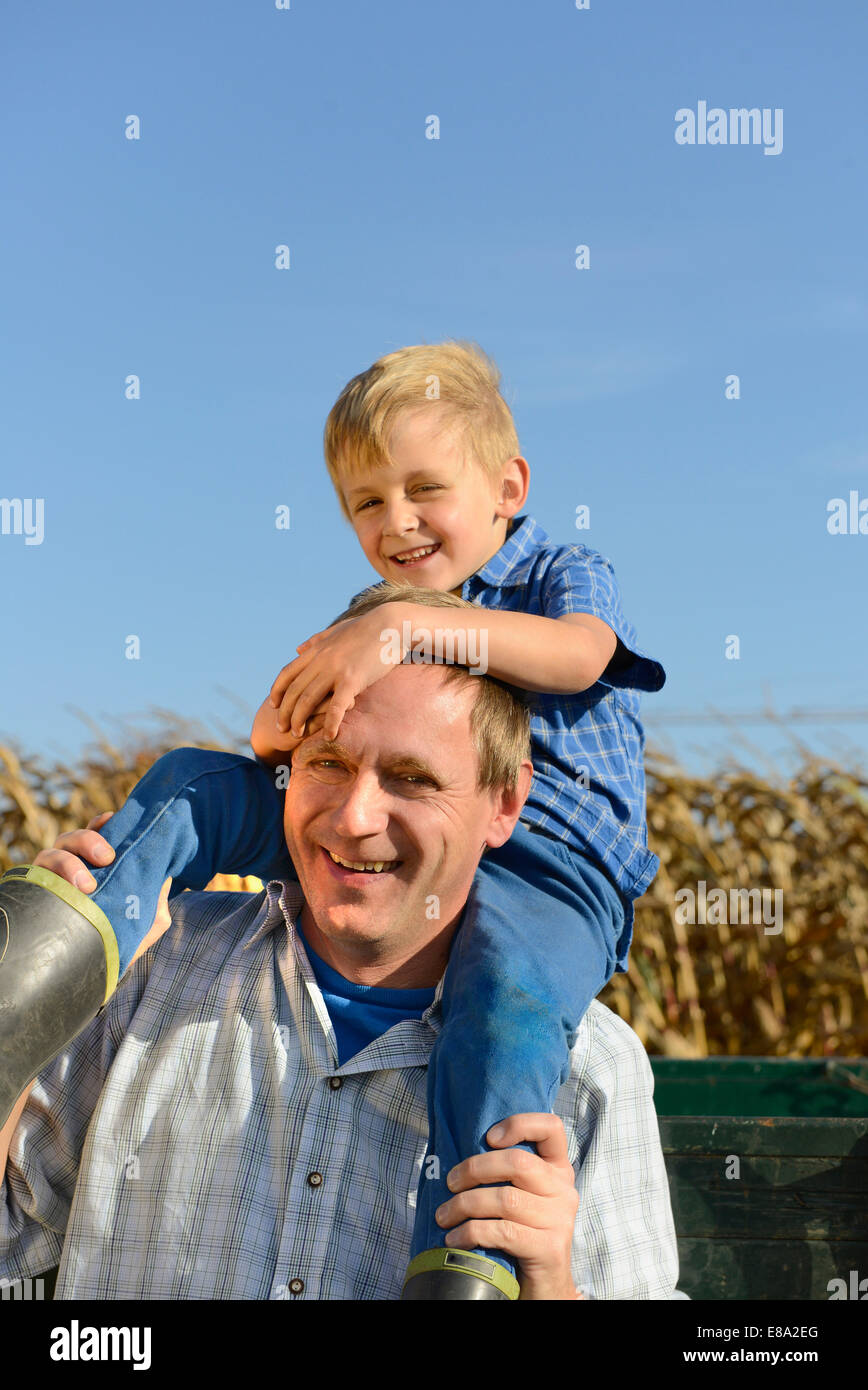 Father carrying his son hi-res stock photography and images - Alamy