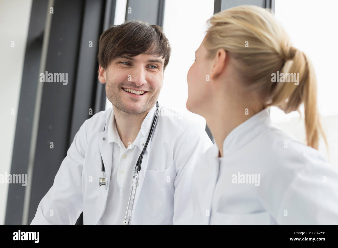 Doctors having conversation, smiling Stock Photo