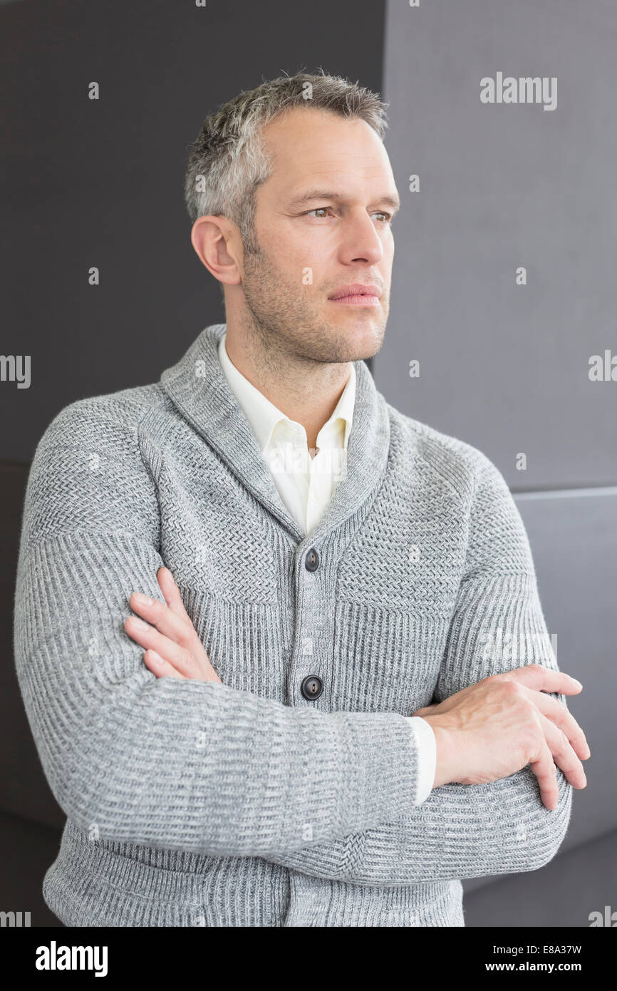 businessman standing with arms crossed, looking away Stock Photo - Alamy