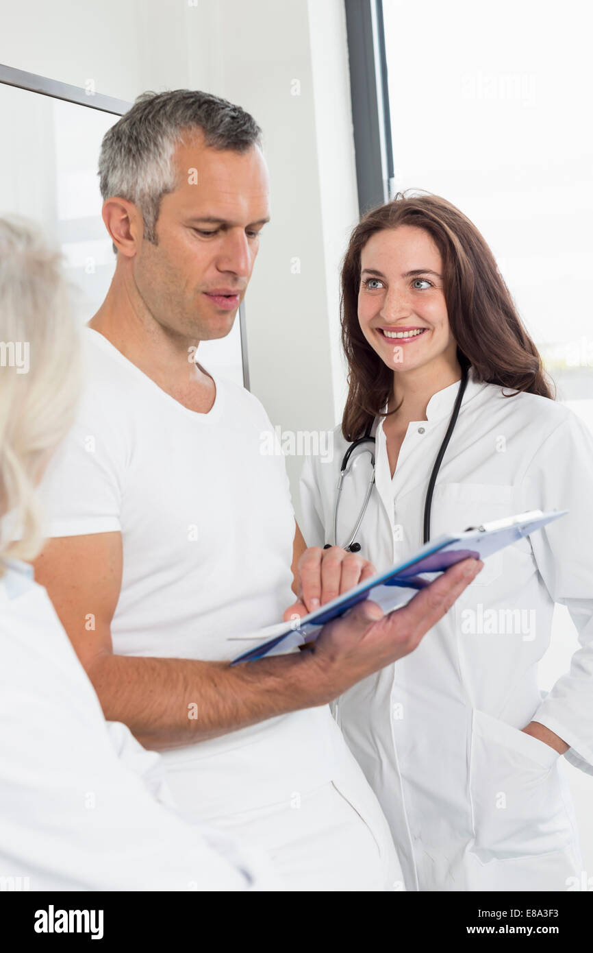 Doctors discussing patient's record Stock Photo