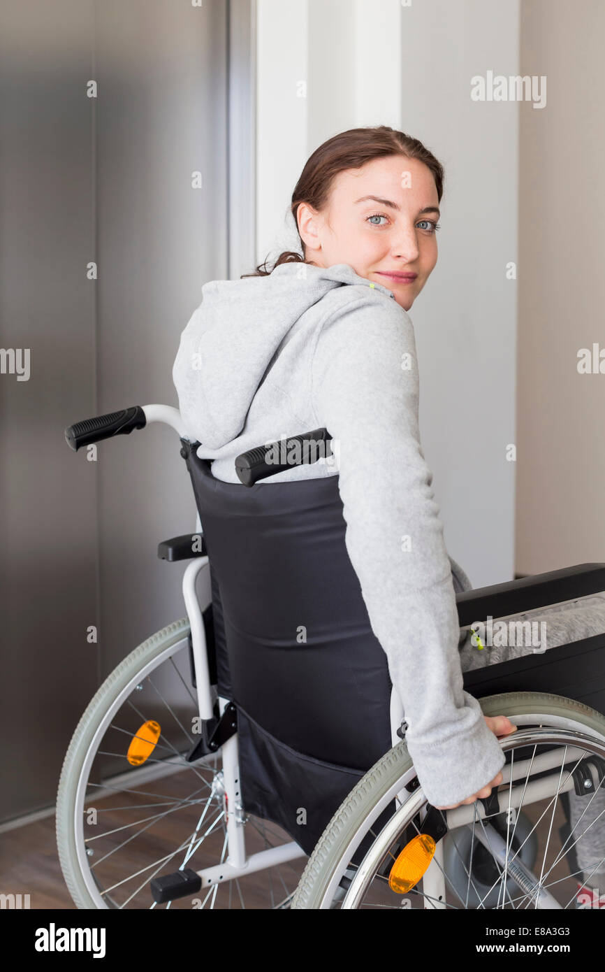 Young woman using wheelchair Stock Photo Alamy
