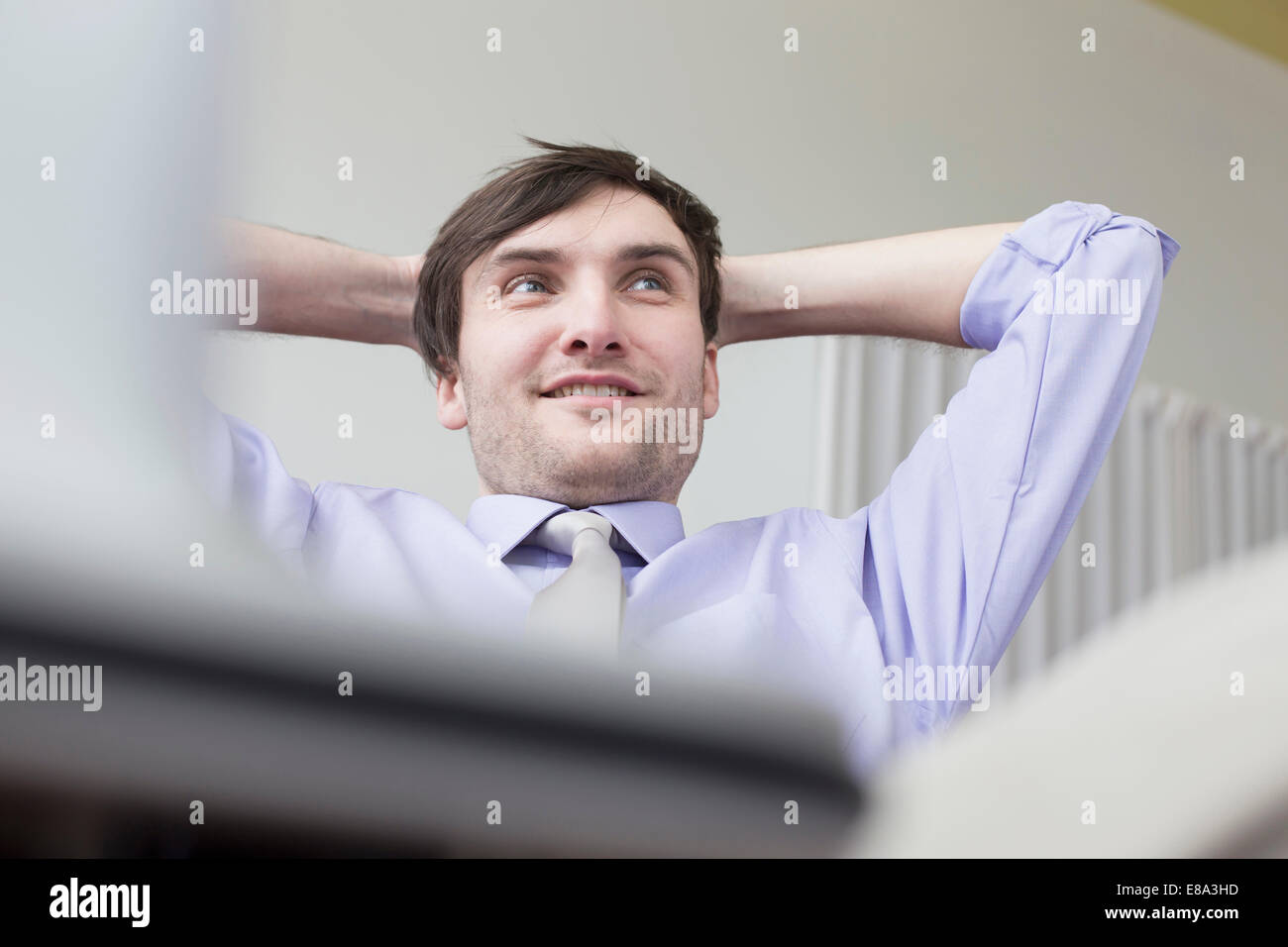 businessman sitting in office, smiling Stock Photo - Alamy