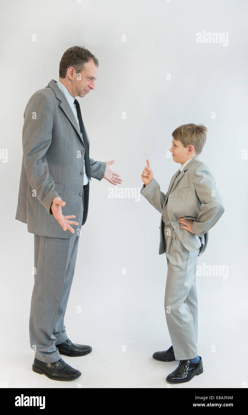 Son blusters his father against white background Stock Photo