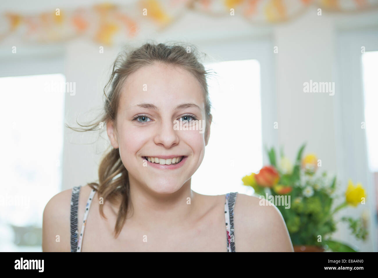 Portrait of girl in living room, smiling Stock Photo - Alamy