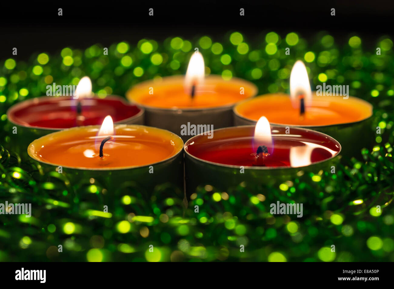 Yellow and orange and green candles hires stock photography and images