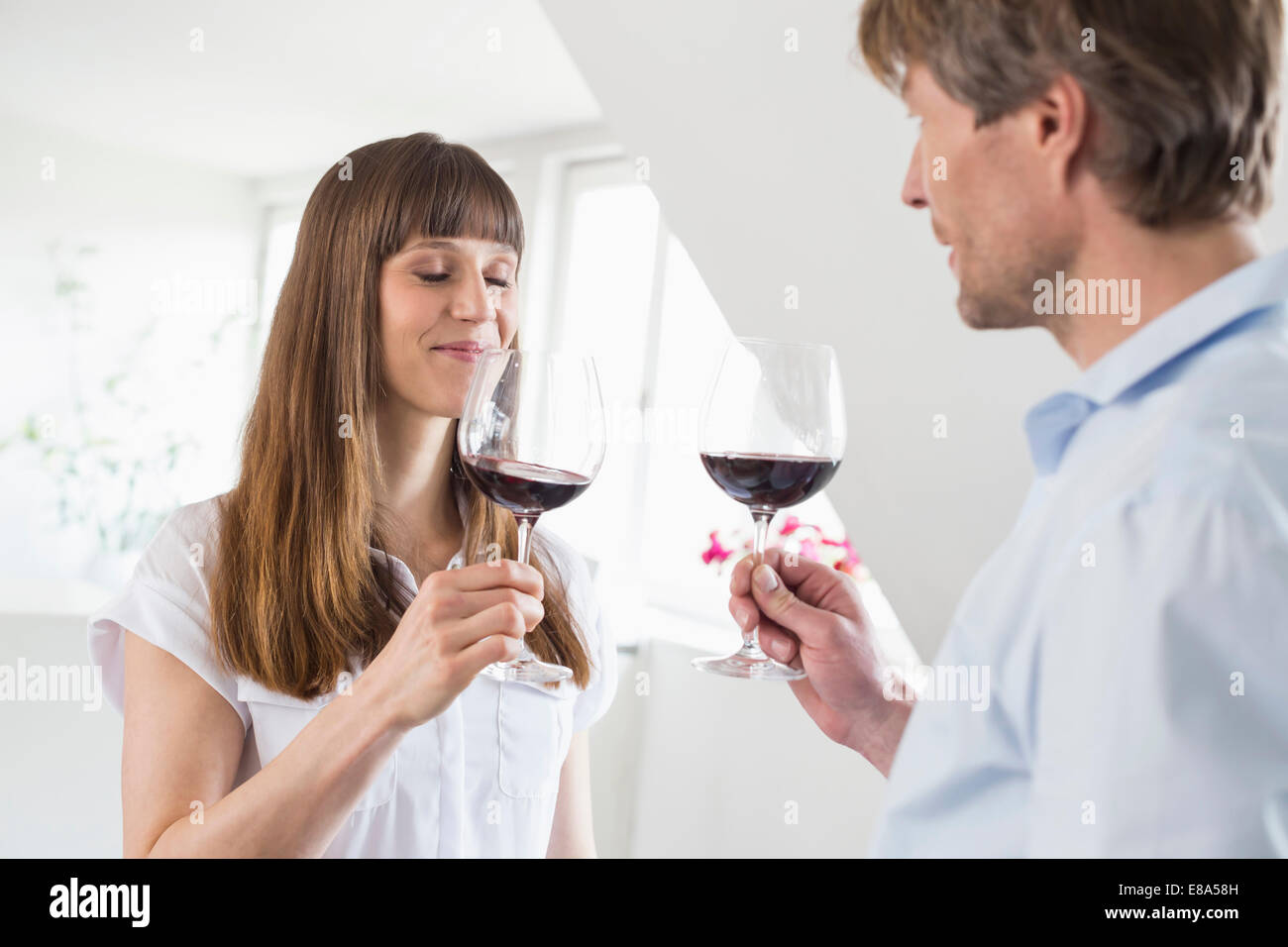 Couple having glass of wine together hi-res stock photography and ...