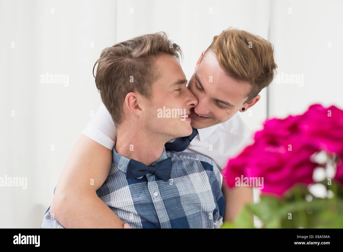 Homosexual couple kissing each other, smiling Stock Photo