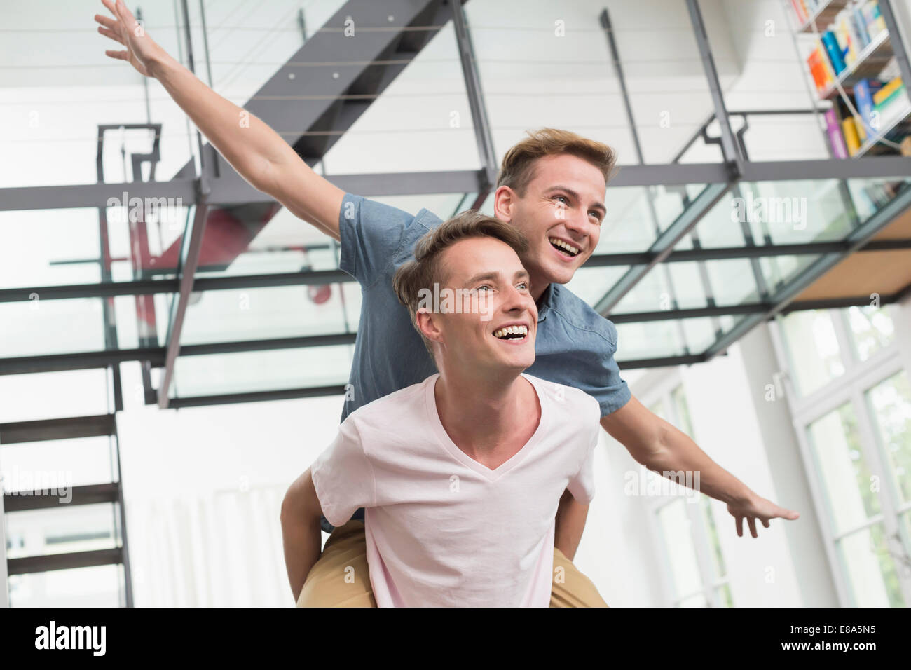 Lovely Gay Couple On Piggyback Ride Stock Photo 1892144086