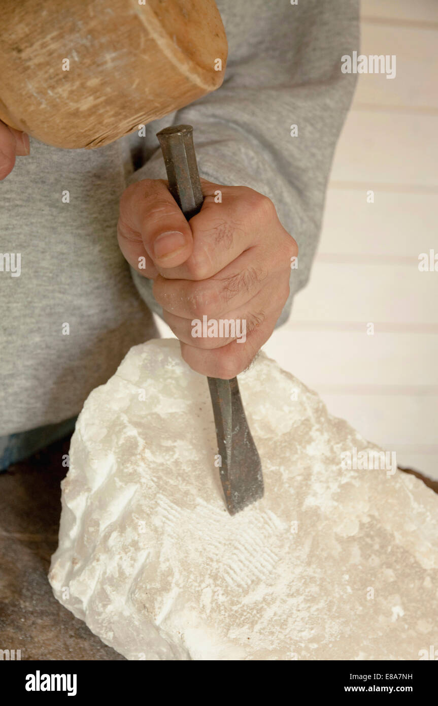 Mature man carving soapstone Stock Photo Alamy