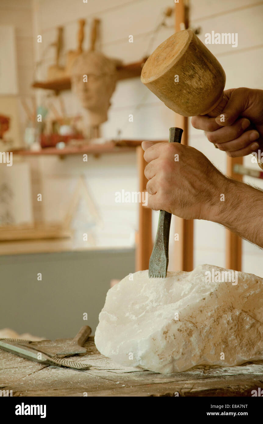 Mature man carving soapstone Stock Photo Alamy