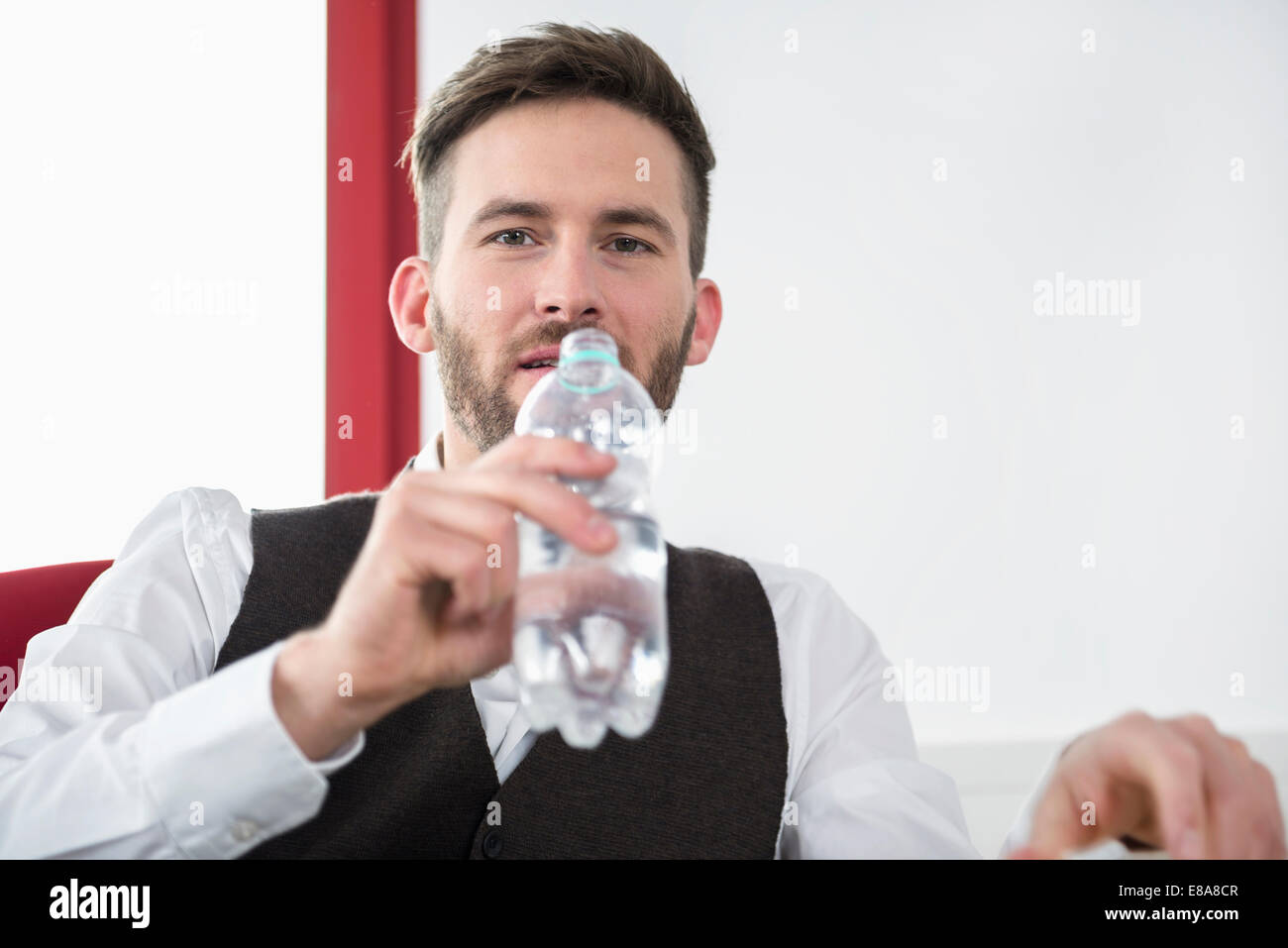Young man office thirsty drinking water Stock Photo Alamy