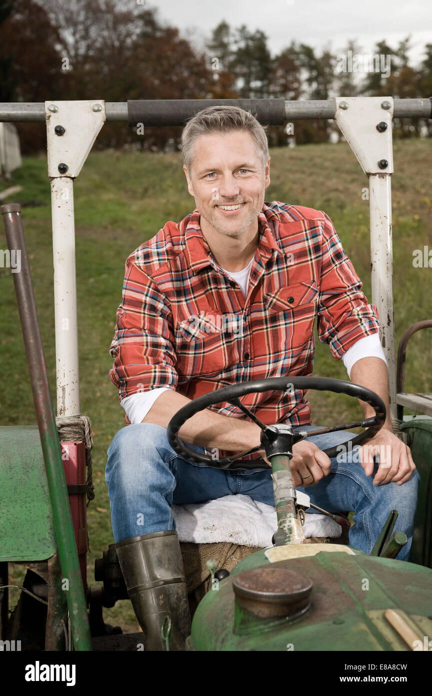 Farmer on tractor hi-res stock photography and images - Alamy